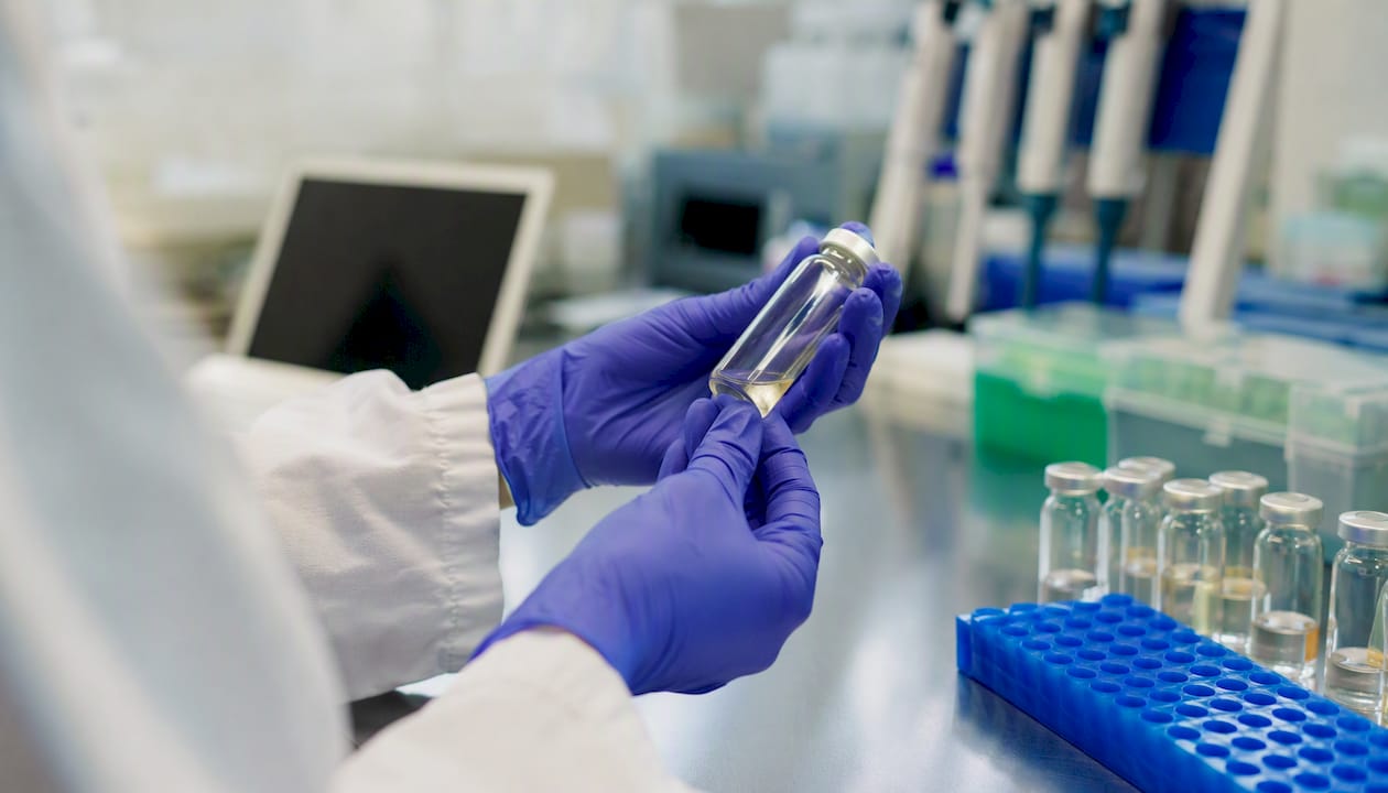 Hands preparing lab samples related to THC transfer