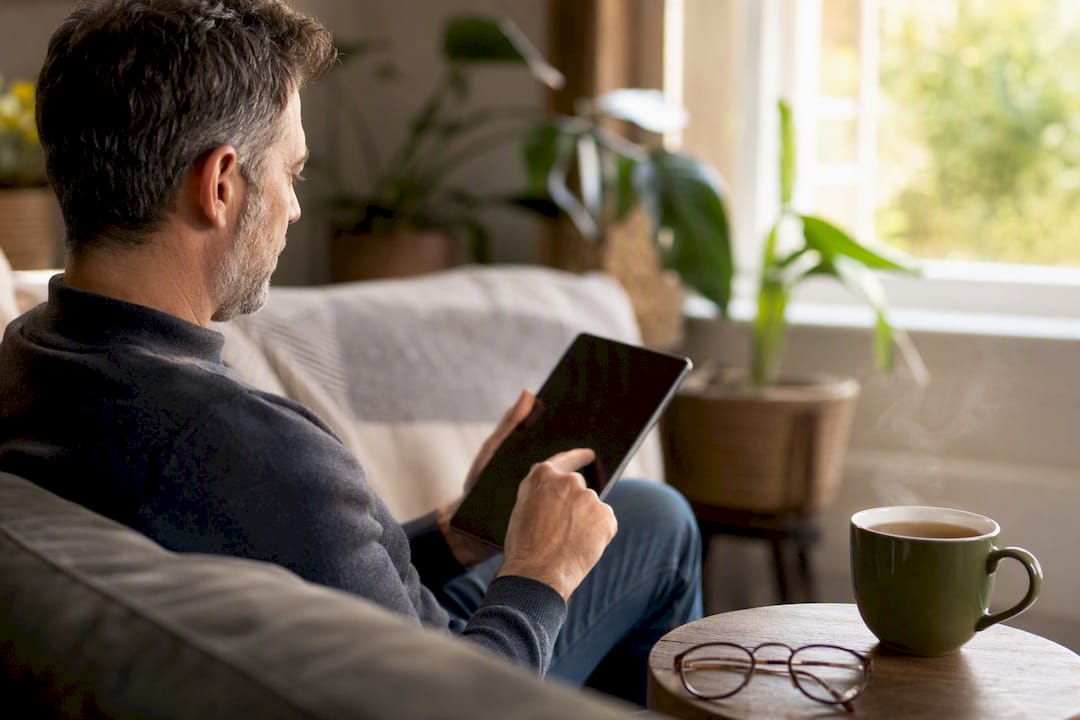 Patient using tablet to book certification online